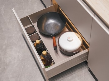 Titled pullout basket drawer